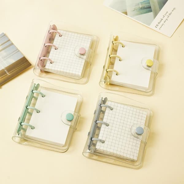 Mini transparent 3-ring binder with grid pages and pockets, clear PVC cover with snap button