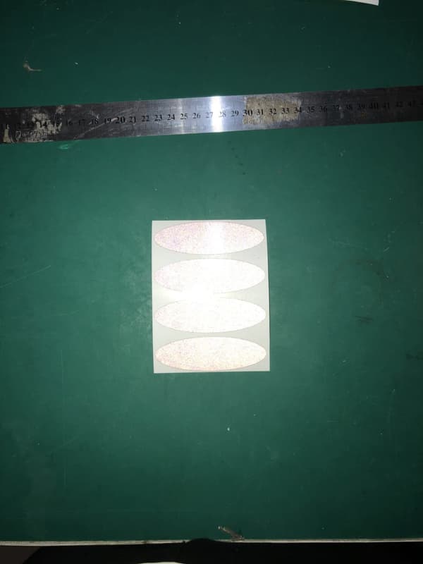 8 heijastavaa tarraa, 8,5 x 2,7 cm, soikea, musta