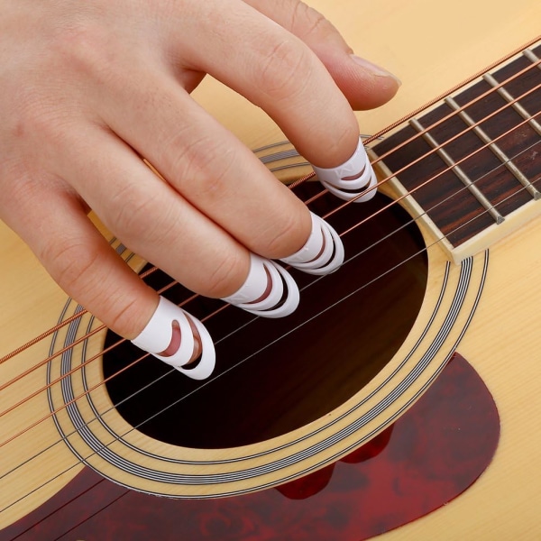 e Set med 4 plastfingerskydd för basgitarr, ukulele,