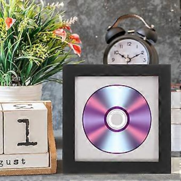 Elegant CD-ramme for utstilling av DVD-er og bilder. Stilig CD-ramme for hjemmet. Multifunksjonell fotoramme.