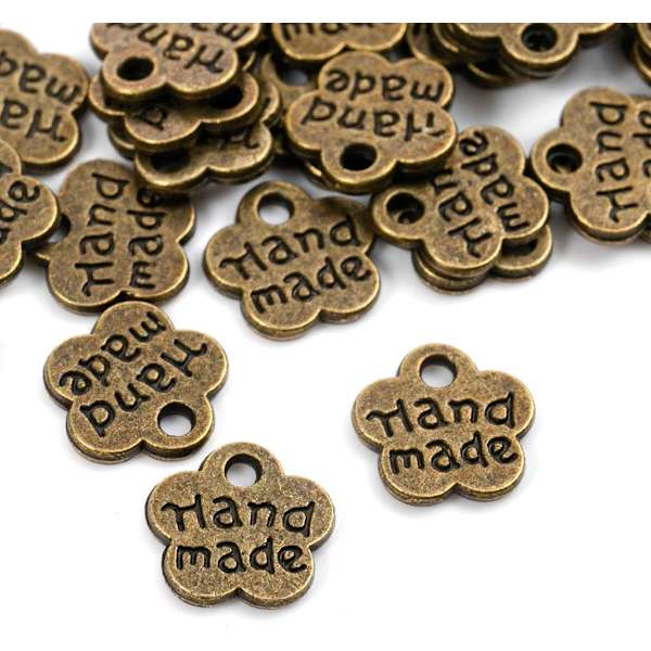 Set med 100 handgjorda antika metallmärken - Handgjorda - Handgjorda D