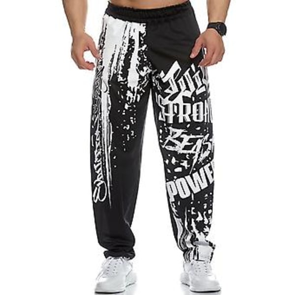 Män Sweatpants Elastisk Midja Tryckt Lös Snabbtorkande Casual Bodybuilding Joggingbyxor för Löpning (XL Svart)