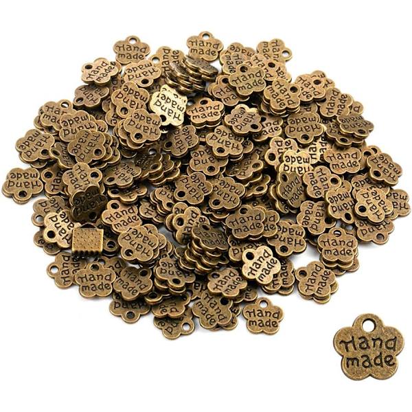 Set med 100 handgjorda antika metallmärken - Handgjorda - Handgjorda D