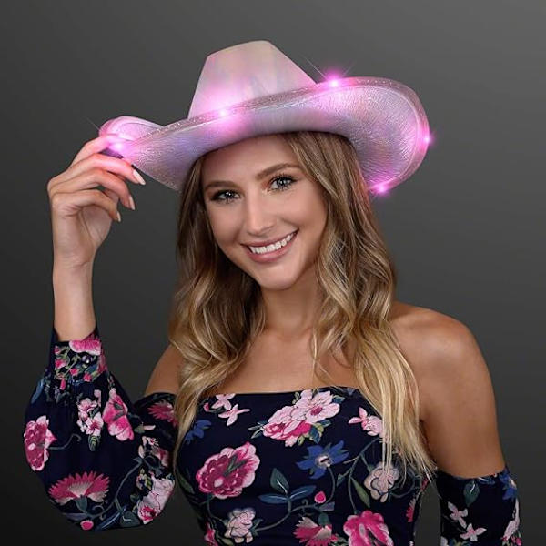 Ljusstark, skimrande rosa rymdhjälm, lysande cowboyhatt