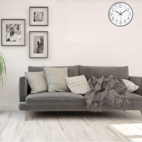 8-tums modern väggklocka, stilren svart ram, vit bakgrund,