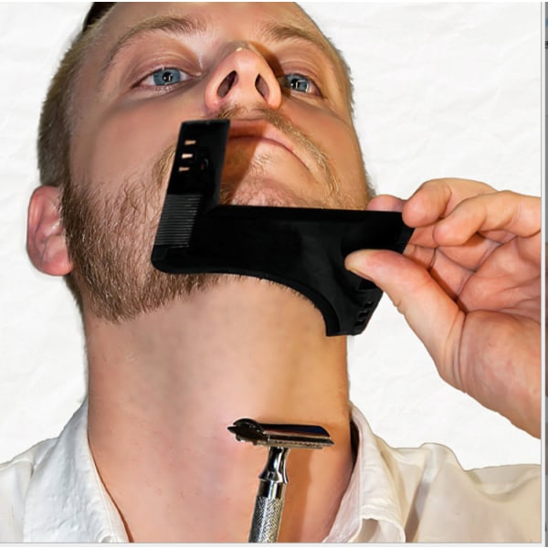 Et svart barberverktøy i ett stykke eller gjennomsiktig mal for trimmi