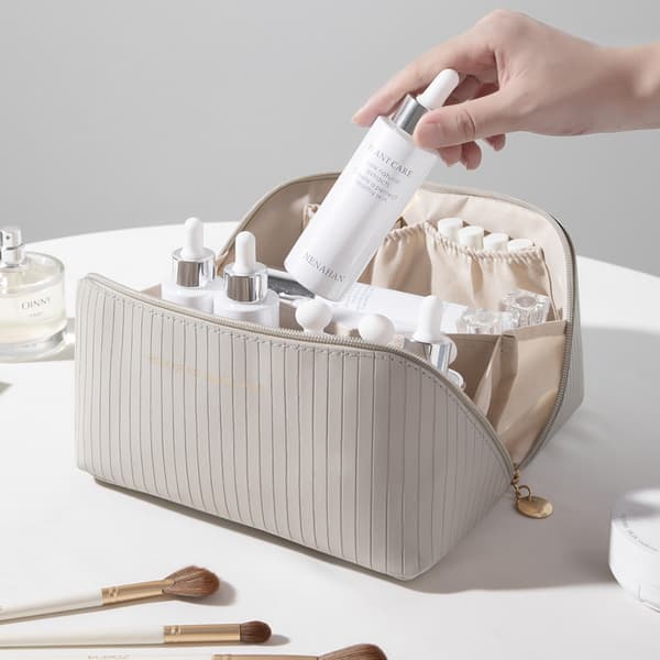 Romslig toalettmappe / sminkeveske Grå