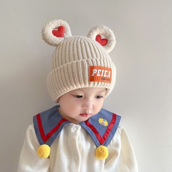 Barnmössor höst och vinter nya baby pullover mössor förtjockade öron skydds mössor för män och kvinnor trendiga varma ylle mössor beige