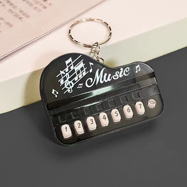 Luova lasten lelu mini elektroninen piano avaimenperä riipus valoisa musiikki ääntäminen soittava elektroninen kosketinsoitin transparent white