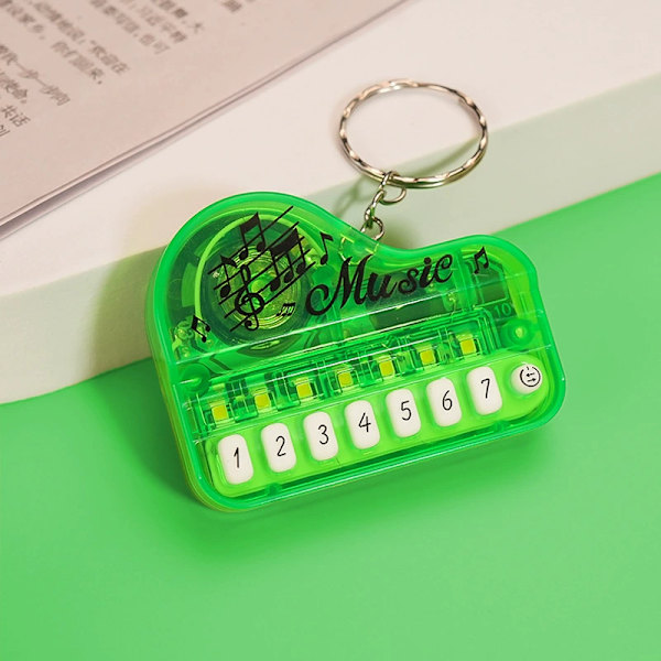 Luova lasten lelu mini elektroninen piano avaimenperä riipus valoisa musiikki ääntäminen soittava elektroninen kosketinsoitin transparent red