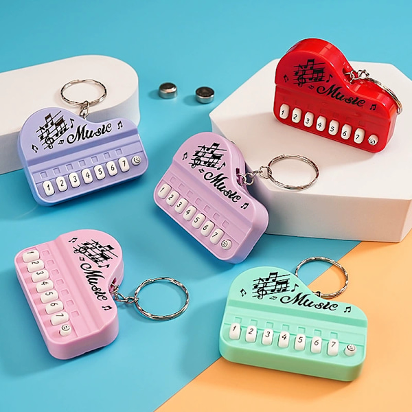 Luova lasten lelu mini elektroninen piano avaimenperä riipus valoisa musiikki ääntäminen soittava elektroninen kosketinsoitin macaron purple