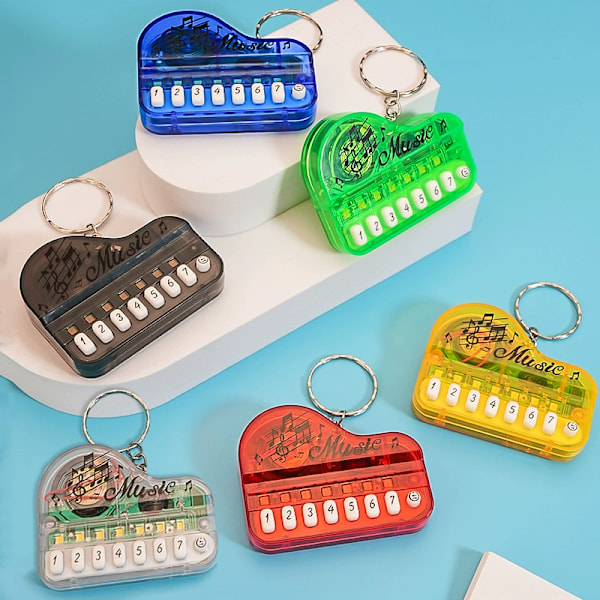Luova lasten lelu mini elektroninen piano avaimenperä riipus valoisa musiikki ääntäminen soittava elektroninen kosketinsoitin transparent red