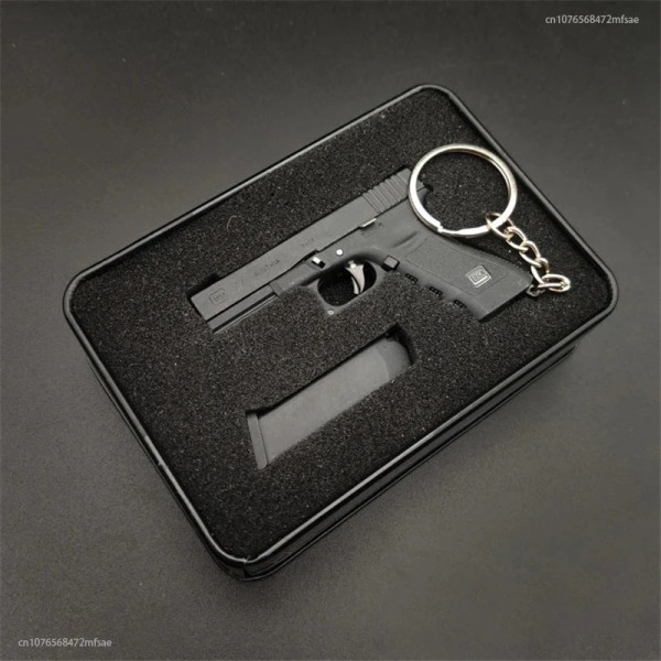 2023 högkvalitativ metallpistolpistol Miniatyrmodell Legering Empire 1:3 Glock Shell Ejection Keychain Model Ornament 9