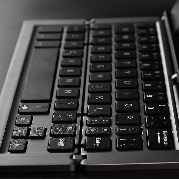 Bærbart mini trådløst Bluetooth-kompatibelt sammenleggbart tastatur Aluminiumslegering Sammenleggbart oppladbart reisekontor hjemmetastatur