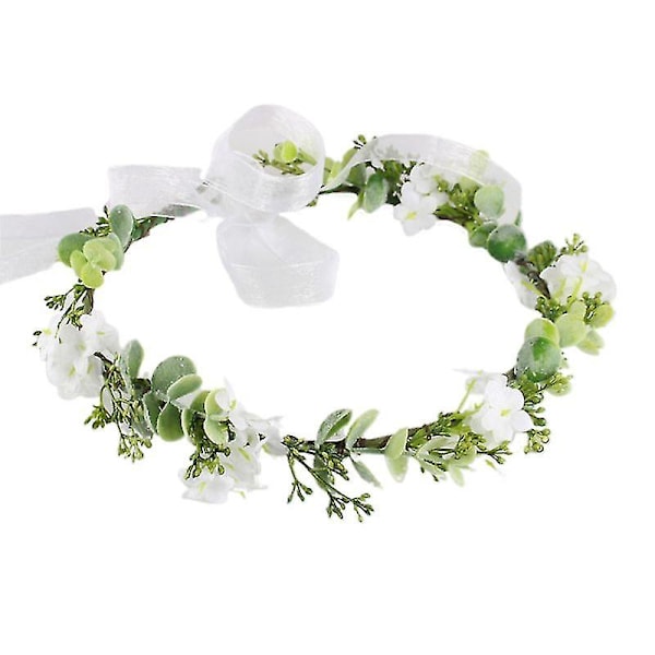 Vit blomma grönt blad