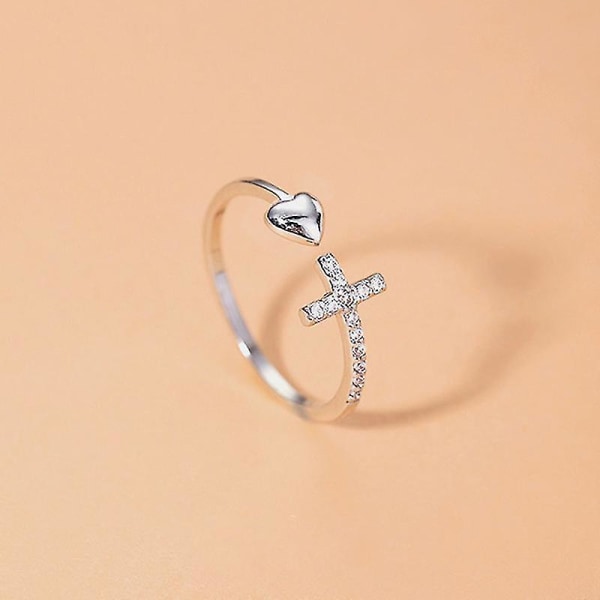 Sølv hjerteformet korsring med åpent hjerte og diamanter