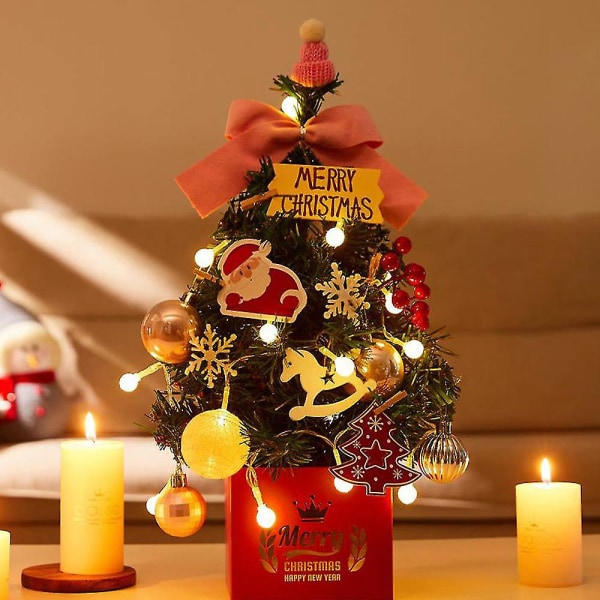 Joulukuusi työpöydällä, koristeellinen pieni joulupuu, hehkuva simulaatiopuu vaaleanpunainen