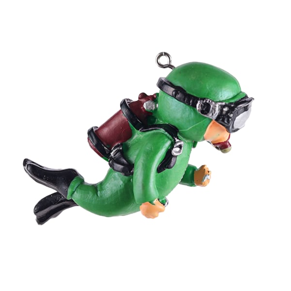 Miniatyr dykarfigur med klar kula och linjemålad kådadekor i harts green