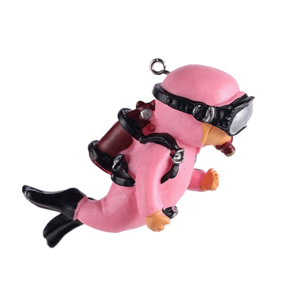 Miniatyr dykarfigur med klar kula och linjemålad kådadekor i harts pink