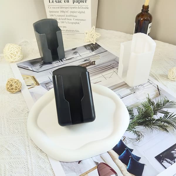 Wall-mounted remote control holder for TV and air conditioning