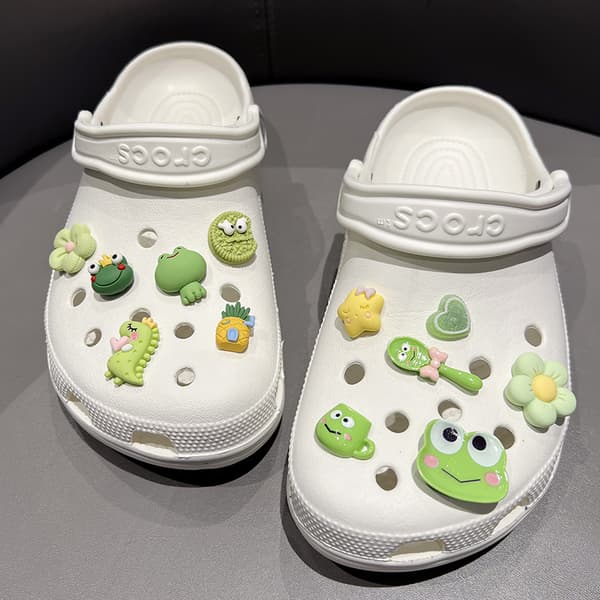 12 stykker friskt dinosaurfrosk skotilbehør