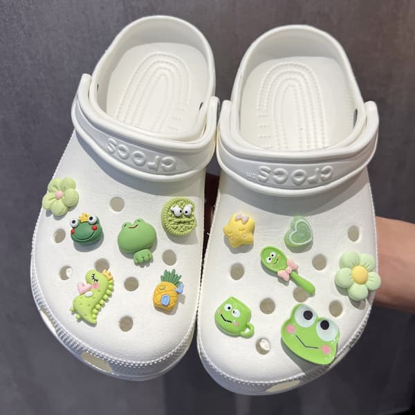 12 stykker friskt dinosaurfrosk skotilbehør
