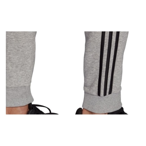 Bukser Adidas Essentials Fleece Tapered Cuff 3STRIPES Grå 176 - 181 cm/L