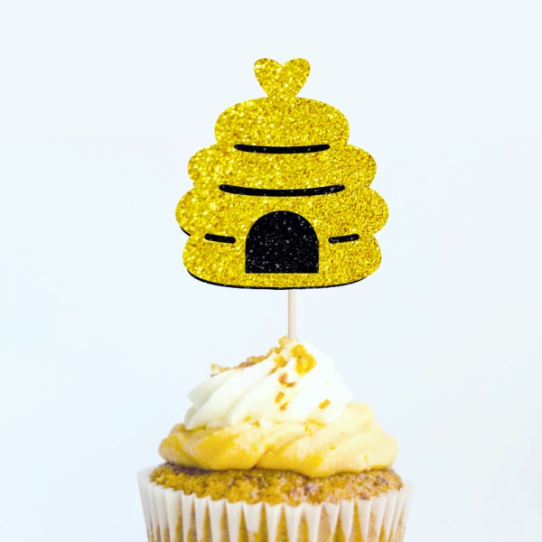 Kreativ baby klä upp glänsande guldbi bakning tårta