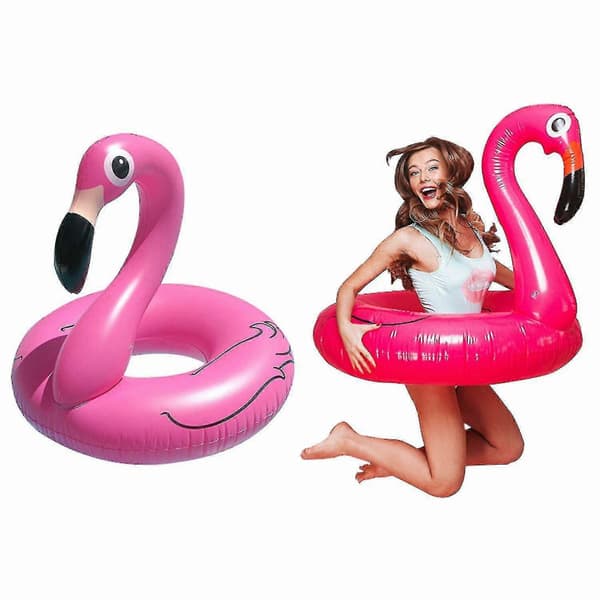 Oppustelig lyserød flamingo svømmering til strand og pool om sommeren