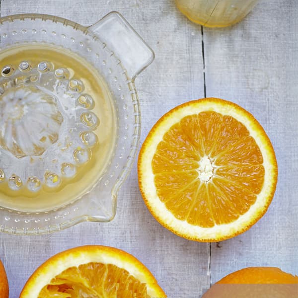 Tradisjonell sitron- og limepresse i glass