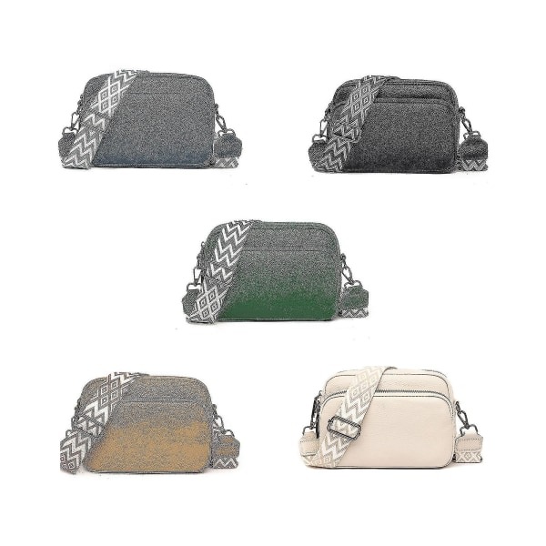 Pieni nahkainen crossbody-laukku, jossa leveä vetoketju ja irrotettava olkahihna, musta