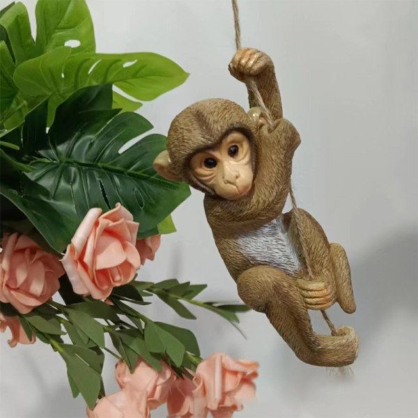 Puutarha-apina roikkuu vauva kiipeää puuhun hartsi A yksi koko