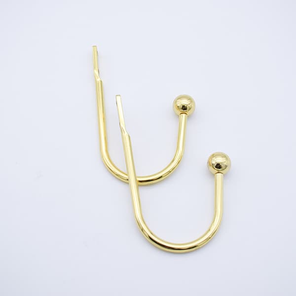 Set med 2 dekorative gardinholdere, bronse roségull