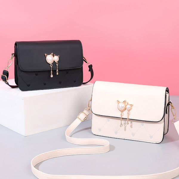 Muodikkaan kissanpään muotoinen crossbody-olkalaukku