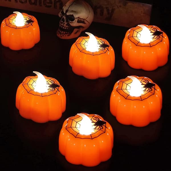 12 stk. Halloween græskar-telys med edderkoppespind-dekor