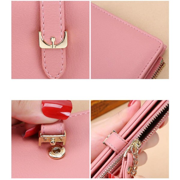 Kvinnors hand som håller lång plånbok mobiltelefonväska - djupt rosa
