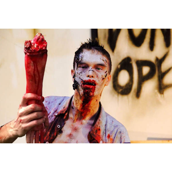 Prosthetic arms, bloody human hands and fingers, corpse fragment