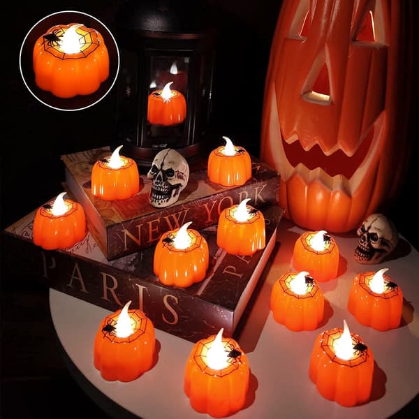 12 stk. Halloween græskar-telys med edderkoppespind-dekor