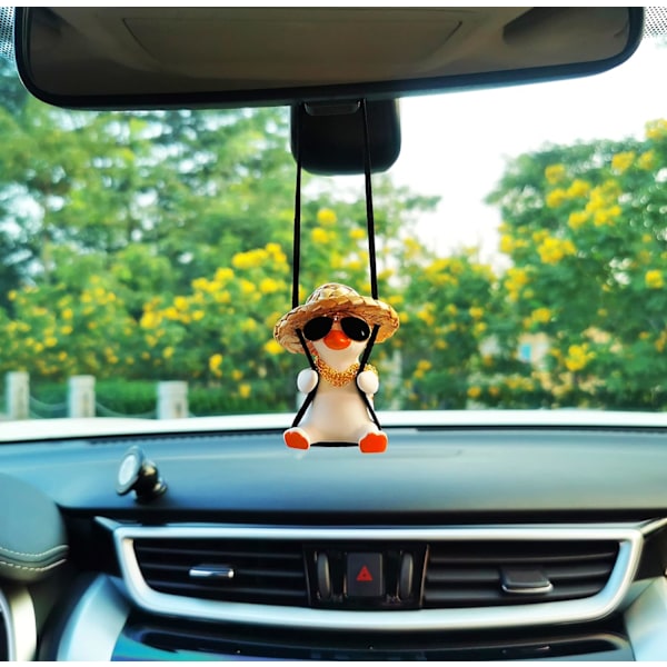 Svingende and dekorative hengefigur av and til bilen