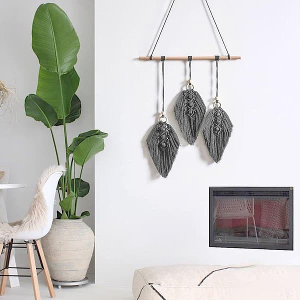 Väggdekoration i boho-stil med bladtofsar, vävd i bomull
