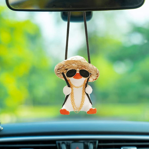 Svingende and dekorative hengefigur av and til bilen