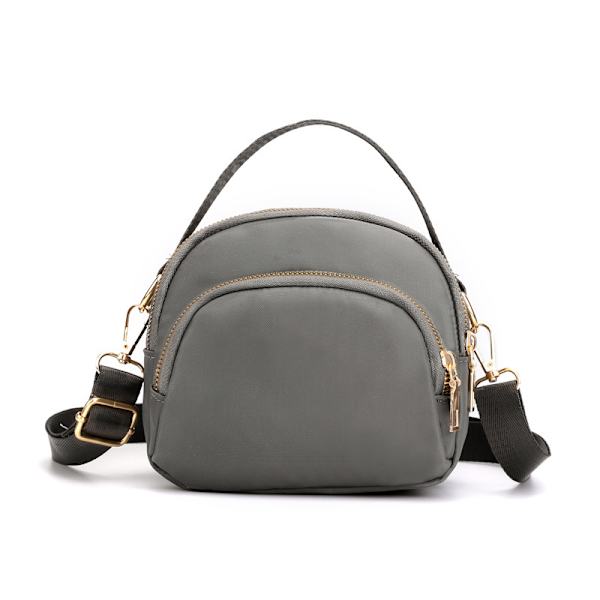 Damtrippel blixtlås canvas crossbody väska light gray