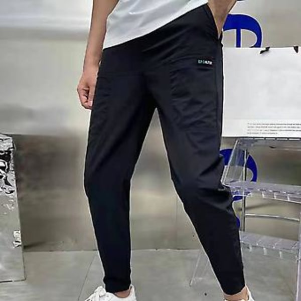 Män Byxor Elastisk Midja Flera Fickor Brev Broderi Ankel Längd Daglig Användning Solid Färg Slim Fit Is Silke Män Pencil Byxor Män Kläder (38 Grå)