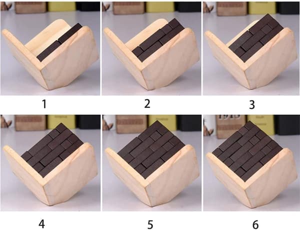 Ett set (54 delar) 3D träpussel av. T-format pussel. Educat