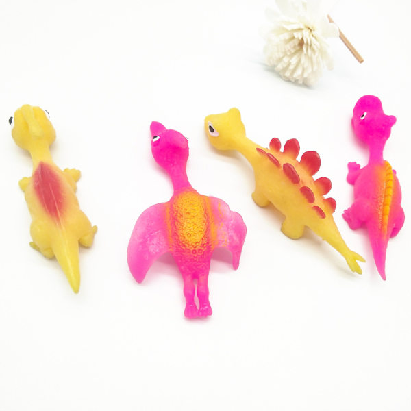 Set med 4 dinosaurie-stressbollar (slumpmässig färg), tecknade kläm-leksaker