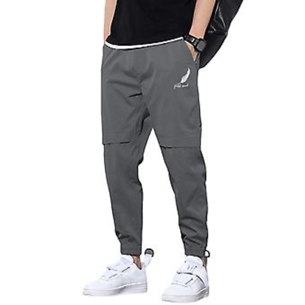 Herrebukser med middels høyde, elastisk linning, logotrykk, lommer, ensfarget, casual, joggebukser, streetwear (5XL mørk grå)