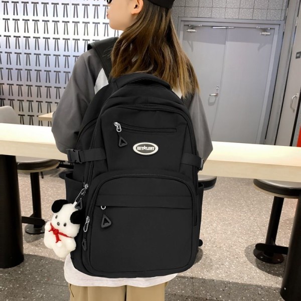 Yksinkertainen monipuolinen opiskelija koululaukku yksinkertainen monitoimi opiskelija naisten koululaukku suuri kapasiteetti pieni tuore olkalaukku tytön reppu-musta