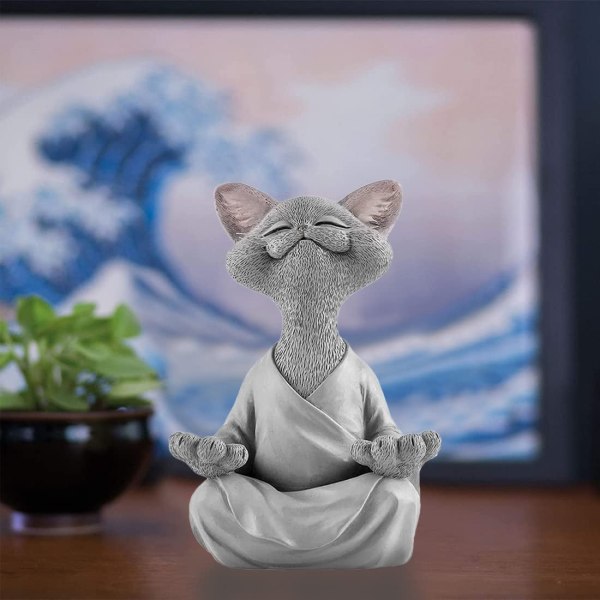 Hartsia meditoiva kissa, harmaa kissa Buddha-patsaan meditaatio, jooga