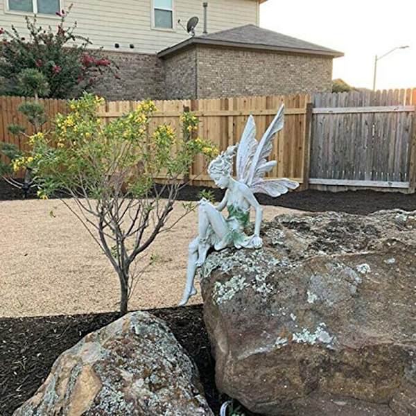 1 stk uavhengig stående sittende holdning fe statue blomst
