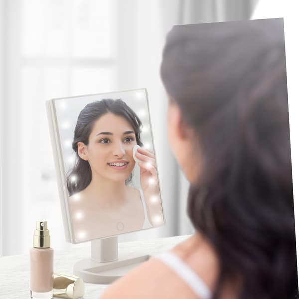 This touch-sensitive LED table mirror illuminates your face for perfect makeup application and features an LED mirror function (white).